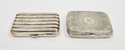 Two Victorian silver cigarette cases, the first of ribbed form, engraved with leafy tendrils,