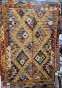 Chobi orange ground kilim with three rows of stepped lozenge medallions, single geometric border