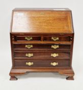 Miniature table-top mahogany bureau in the Georgian manner, the fall front opening to a fitted