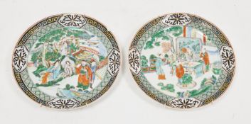 Two Chinese famille verte dishes, 19th century, each painted with figures in discussion before
