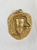 Egyptian gold-coloured metal pendant with pharaoh's head and serpent decoration to a matt finish