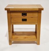 Contemporary oak veneer side table, the rectangular top over two drawers having metal drop loop