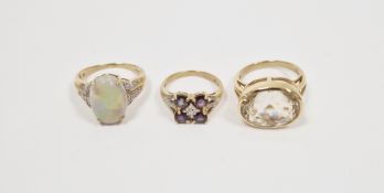 9ct white gold opal doublet ring with small white stones set to the shoulders and two coloured stone