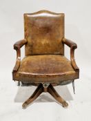 Mid century Hillcrest office swivel elbow chair, with brown leather studded upholstery, on four