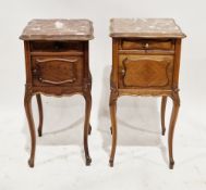Two similar French Louis XV-style walnut bedside cabinets, each of square form with marble inset top