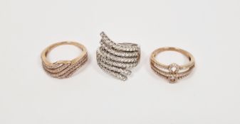 Two lady's 9ct yellow gold dress rings set with white stones and a similar lady's 9ct white gold