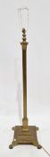 Brass Corinthian column standard lamp on a square stepped base with lion paw feet, 134cm high