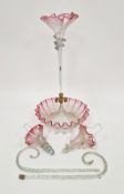 Victorian cranberry glass epergne, with central trumpet-shaped stem issuing and tier spirally