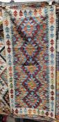 Chobi kilim blue ground runner, with five stepped joined lozenge medallions, single geometric border