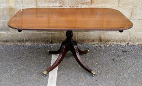 Regency mahogany tilt-top breakfast table, the rectangular top with rounded corners and having a