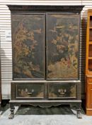 Late 19th/early 20th century black lacquered wardrobe with chinoiserie decoration of birds, fish and