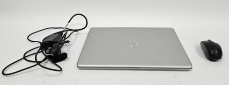 HP laptop computer, model 15S-FQ5510SA, with power cable and mouse