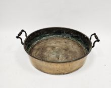 19th century bronze jam or cooking pan, of round form, having twin shaped and ringed copper handles,