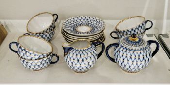 Russian (Lomonosov) cobalt net pattern part tea service, 20th century, printed red factory marks,
