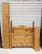 Modern pine single bedframe, arched head and footboards, with tall turned finials, 103cm wide x