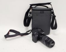 Canon EOS 200D SLR camera with a Canon EF 75-300mm lens, with soft case