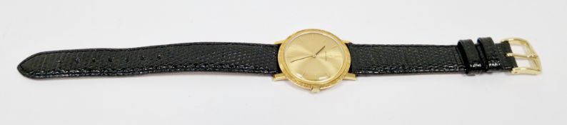 Vintage yellow metal Omega gentleman's dress watch, the gilt dial with raised baton hour markers,