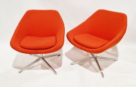 Pair of Allermuir open lounge chairs, model no. A640, upholstered in an orange fabric with cushion