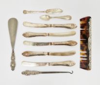Elizabeth II silver-backed comb together with five silver-handled butter knives, a Victorian