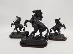 Pair of spelter Marley horses on mahogany oval plinths, 23cm high and a single spelter Marley