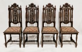 Set of four Victorian oak dining chairs in the 17th century manner, the carved cresting flanked