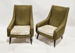 Pair of mid century armchairs by Minty of Oxford, upholstered in a green fabric with floral