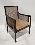 Edwardian mahogany and bergere library chair, with square back on turned legs on castors, 92cm