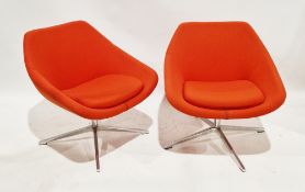 Pair of Allermuir open lounge chairs, model no. A640, upholstered in an orange fabric with cushion