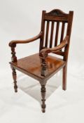Victorian mahogany hall elbow chair, the arched top rail carved with shell and foliage, carved
