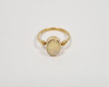 Yellow metal lady's ring set with an oval opal doublet, the ring stamped 18ct, gross weight 2.8g