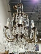 A pair of early 20th century gilt-bronze and cut glass birdcage chandeliers in the Louis XV style,