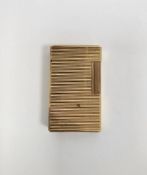 S.T. Dupont French gold plated pocket lighter with engine-turned decoration, 5.5cm high