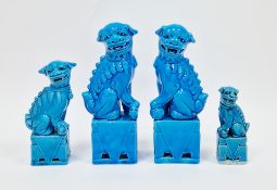 Pair of Chinese porcelain turquoise glazed Dogs of Fo and two other smaller similar, impressed