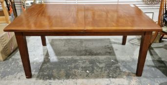 Modern hardwood extending dining room table, the rectangular top on square tapering legs with one