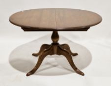 Ercol Windsor Range dining room table and chairs, the elm-topped oval dining table with concealed