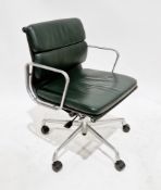 After Charles and Ray Eames, an EA (208) swivel elbow chair, upholstered in green leatherette with