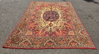 Large cream ground carpet with central floral medallion, floral field and spandrels, multiple floral