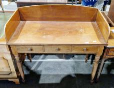 Victorian mahogany washstand, the top with high upstand to three sides, over three frieze drawers