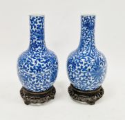 Matched pair of Chinese porcelain blue and white bottle-shaped vases, probably 19th century, each