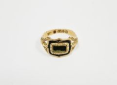 George IV 18ct gold and enamel mourning ring, the shaped rectangular top central panel surrounded by