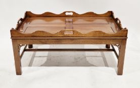 Mahogany coffee table in the George III style, the top with pierced shaped gallery rail, on square