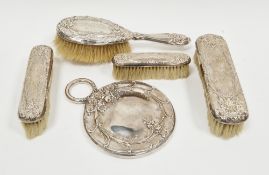 Sterling silver backed five-piece dressing table set, circa 1900's, comprising a handheld mirror