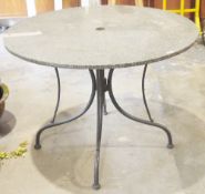Circular garden table consisting of polished stone table top, on a metal base, 100cm diameter x 70cm