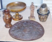 Quantity of wooden items including a sculpture of a man standing with stick and smoking a pipe, in