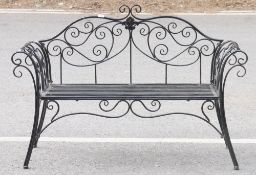 Black painted metal garden bench with scrolling design, 130cm wide