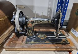 Cased Singer sewing machine, ref Y5851140 and a cased Frister & Rossmann sewing machine, ref 3777756