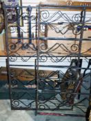 Pair wrought iron two-panel gates with scrolling decoration, each panel 84cm high x 131cm wide