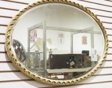 Two gilt framed oval wall mirrors (2)