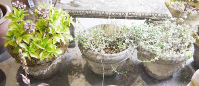 Three reconstituted stone planters moulded with swags, 46cm diameter (3)