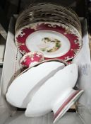 Small part dinner service 19th century decorated with rural scene, including dinner plates, a cake